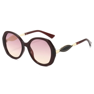 Oversized runde Brille in Schildpattoptik mit rosa Verlauf und Gold-Metallbügeln