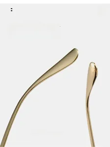 Detail of ergonomic curved gold metal sunglasses temples for comfortable wear