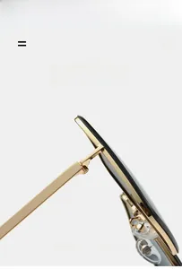 Detail of metal square frame sunglasses hinge and super elastic lightweight golden temple