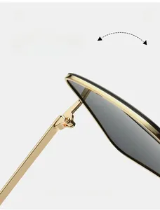 Macro view of durable metal hinge on golden square sunglasses with smooth finish