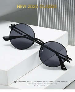 Close-up of retro round black metal frames on minimalist white display with textured glass