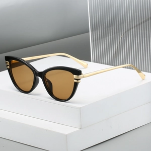Retro cat-eye sunglasses with black frame, amber lenses and slim golden metal temples