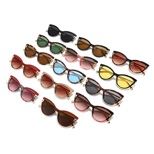 Chic cat eye sunglasses collection in various colors with trendy gold metal accents
