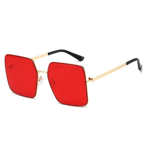 Classic square metal sunglasses with red lenses and gold frames in 45-degree view
