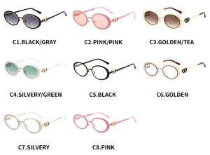 Detail view of oval sunglasses featuring unique metallic double heart cut-out on the temples