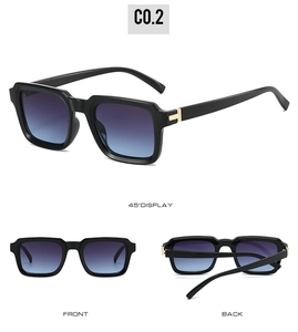 Detail view of square sunglasses featuring gradient lenses and gold T-shaped metal hinges