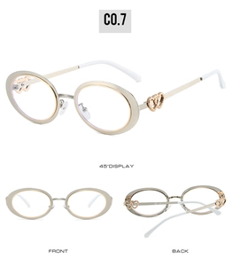 Detailed views of oval gold frames with dual heart cutout accents and white temple tips