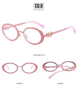 Detail view of pink oval children sunglasses with golden wire trim and heart-shaped temple hinges