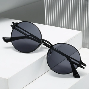 Retro round frame sunglasses with black metal frames and dark grey lenses for men and women