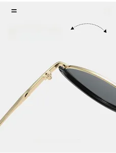 Detailed close-up of a durable golden metal hinge on cat-eye sunglasses for women