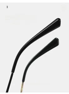 Detail of curved ergonomic temple arms on small cat eye sunglasses for comfortable wear