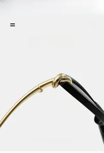 Detailed close-up of golden metal knot hinge and flexible black temples of sunglasses