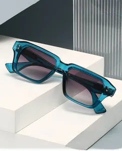 Detail of square blue translucent frame with purple gradient lenses and metal accents