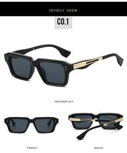 Detail view of square black sunglasses with gold metal temple accents and grey lenses