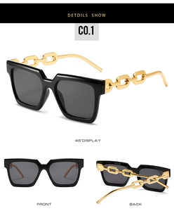 Detailed views of black square sunglasses with bold gold metal chain temples for women