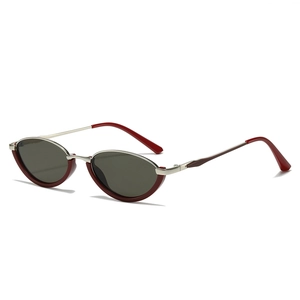 Retro small oval cat eye sunglasses with burgundy frames and silver metal temples
