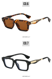 Detail view of square fashion sunglasses with gold metal accents in tortoiseshell and black