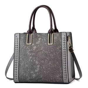 Elegant grey PU leather handbag with lace flower texture and detachable shoulder strap