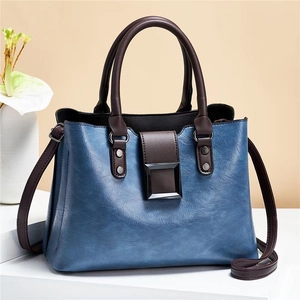 Große Retro-Umhängetasche aus Kunstleder in Vintage-Blau und Braun mit Kontrast