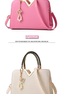 Detail of V-shaped metal trim and embossed geometric texture on stylish handbags