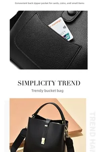 Detail of the back zipper pocket on a black litchi pattern leather bucket handbag