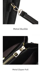 Detail of gold metal zipper and lobster clasp on black checkered embossed leather bag