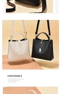 Detail showing high-quality lychee grain texture and metal buckle on bucket handbags