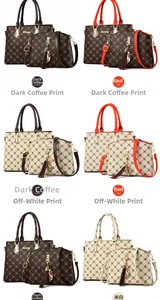Detail of printed tote set with shell crossbody bag, feline charm, and tassel accents