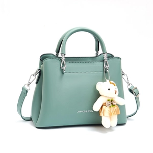 Mint green PU leather handbag with JING&PIN logo and cute white bear charm accessory