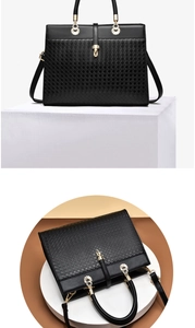 Detail of black woven tote bag with golden hardware and detachable shoulder strap