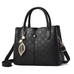 Elegant black textured leather handbag with plaid embossing and pearl leaf pendant details