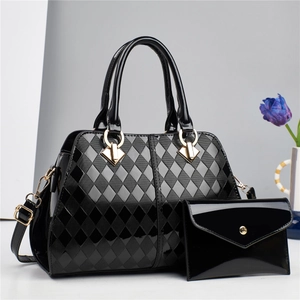 Quilted black patent leather handbag set with gold hardware and matching wallet