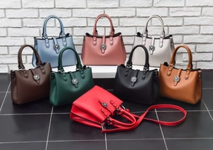Front view detail of a square PU leather handbag featuring a floral metal buckle in 8 colors
