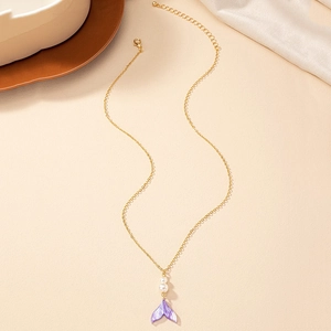 Elegant gold necklace featuring a purple gradient mermaid tail pendant and white pearls