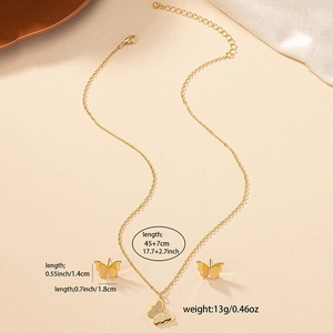 Elegant gold butterfly jewelry set including a pendant necklace and stud earrings