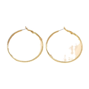 Textured gold hoop earrings with granular pattern for women in a minimalist style
