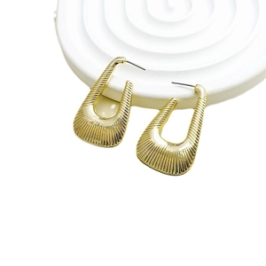 Vintage golden U-shaped earrings with fine geometric radial textures in a high-shine finish