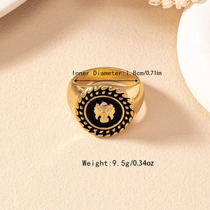 Vintage gold ring with black enamel and lion head engraving, 1.8cm inner diameter