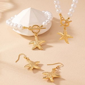 Summer ocean style jewelry set with pearl starfish necklace, bracelet, and earrings