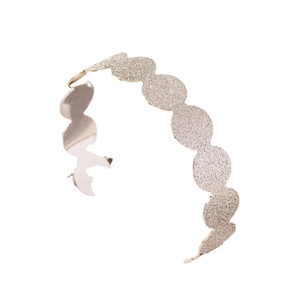Fashionable champagne gold frosted wave headband with shimmering glitter finish