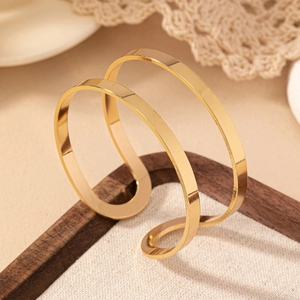 Polished gold double-layer open cuff bracelet with minimalist geometric parallel bands