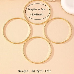 Set of 4 gold bangles with geometric rhombus texture 6.7cm diameter and 33.2g weight