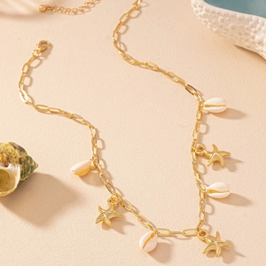 Golden starfish and white shell pendant necklace for a beach vacation style look
