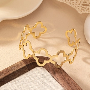 Elegant gold clover hollow-out open bangle in polished stainless steel for women