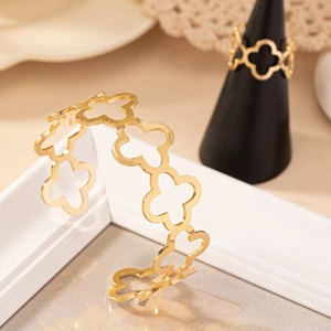 Golden open hollow clover bracelet and ring set for women in elegant minimalist style