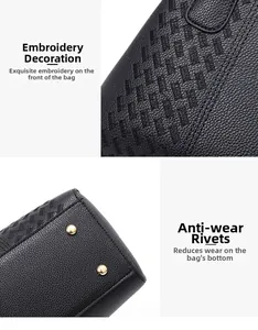 Détail du sac en cuir brodé avec rivets de protection dorés et coutures