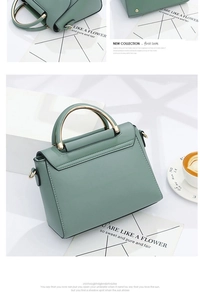 Détail du sac à main en cuir vert menthe avec poignée en anneau doré et fermoir en métal