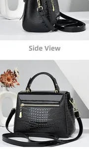 Detailed back and side view of black lizard texture handbag with gold metal hardware