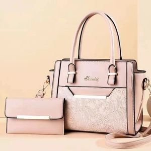Two-piece pink faux leather handbag set with lace texture and golden metal logo