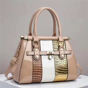 Chic multi-texture patchwork tote bag with glossy lizard pattern and adjustable strap